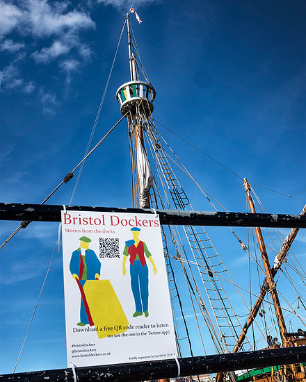 Bristol dockers sign: illustratio of dock porters hanging from mast of old ship