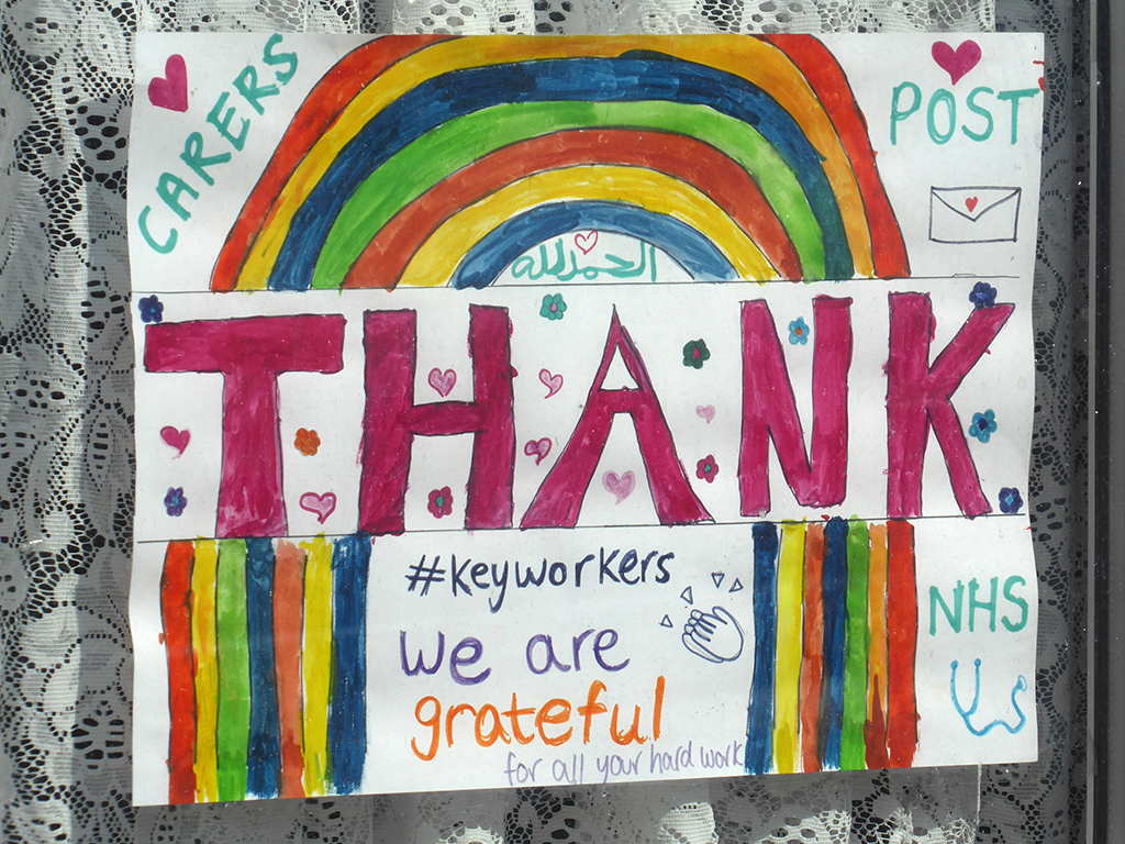 Childs rainbow illustration with text. Thank keyworkers: Carers, Post, NHS; we are grateful for all you hard work