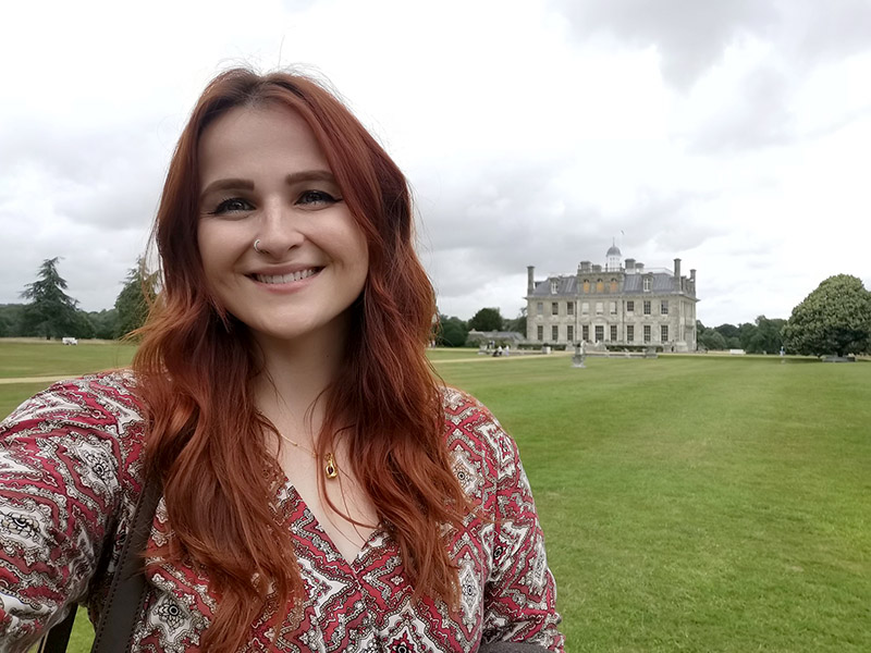 Lauren Cochrane against background of Kingston Lacy country house